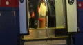 Men and women entering city tram, carrying heavy plastic bags after shopping HD Footage