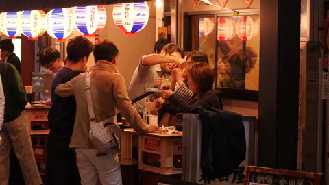 Men and women getting drunk at bar. Toky... | Stock Video | Pond5