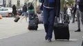 Men and women moving in the street near railway station, tourism, city life HD Footage