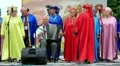 Men and women in multicoloured costume sing a song HD Footage