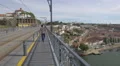 Men and women walking on Dom Luis Bridge in Porto 4k or 4k+ Resolution
