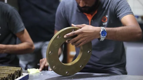 Men apply grace on the casting part in factory. Industrial safety first concept Stock Footage 297739391