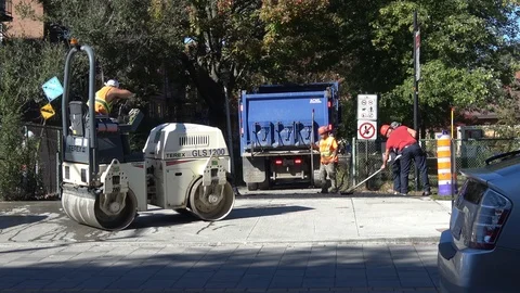 Men applying asphalt - Wide view Stock Footage 89571641