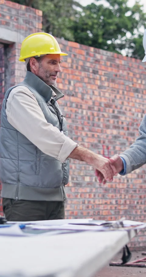 Men, architect or partnership with handshake on construction site for building Stock Footage 340952683