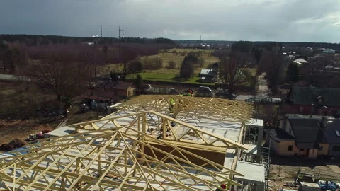 Men are Assembling the Framework for the Roof - Aerial Drone Shot Stock Footage 263791805