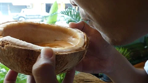 Men are drinking coffee from coconut shells. 스톡 동영상 108264830