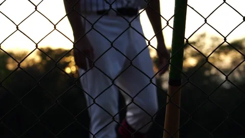 Men are hitting the baseball player with the sunset Stock Footage 121239030