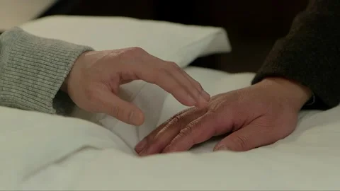 The men are holding hands as an expression of emotion Stock Footage 261642497