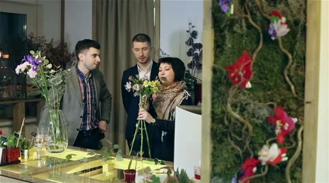Men are learning how bouquets of flowers creating. Stock Footage 61490324