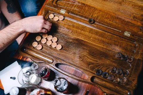 Men are playing backgammon in a bub, directly above view Stock Photos