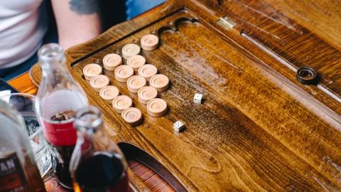 Men are playing backgammon in a bub, directly above view Stock Photos