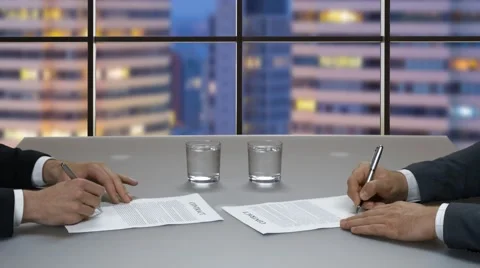 Men are signing documents. Stock Footage