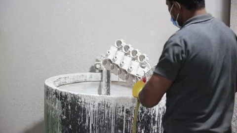 Men are working a sand coating machine. Industrial safety first concept. Stock Footage 297277047