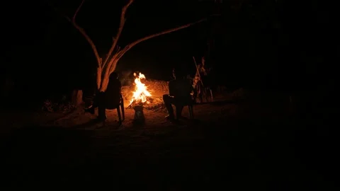 Men around a warm fire in the middle of the night, in Ethiopia Stock Footage 199622447