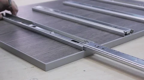 A men assembles the cabinet Stock Footage 59156336