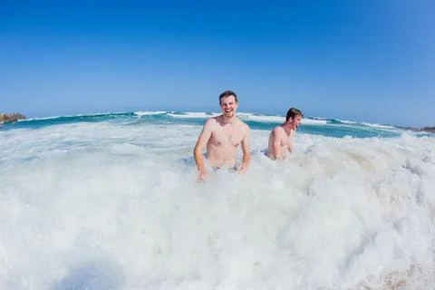 Men Beach Ocean Swim Stock Photos