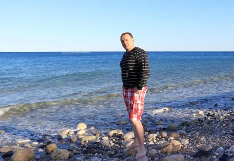 Men on the beach Foto stock