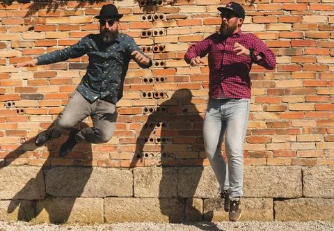 Men with beards jump Stock Photos