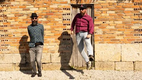 Men with beards jump Stock Photos