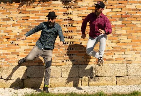Men with beards jump Foto stock
