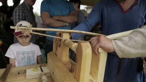 Men behind a sharpener Stock Footage 82359997