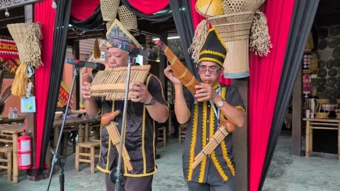 Men blowing Sompoton and Sinompuru flutes Stock Footage 312762322