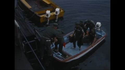 Men board and load supplies in support vessel - 1965 Stock Footage 103201565