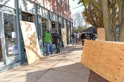Men Boarding Up Windows in Ferguson Stock Photos