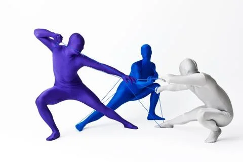 Men in bodysuits playing with string Foto stock