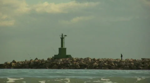 Men by the breakwater 库存影片 299789