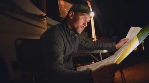 Men Browsing Paper Map of Local Area in Front of Motorhome RV Camper Van Video stock 141038563