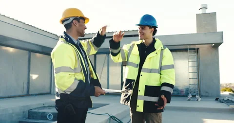 Men, builder or high five with electrician on construction site for maintenance Stock Footage 345573057