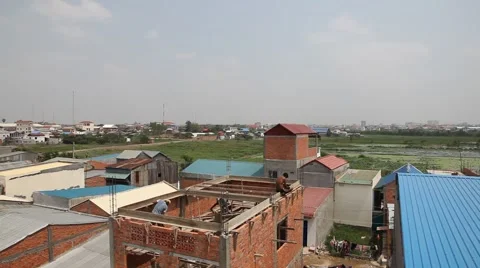 Men building brick house in poor village Cambodia WS Stock Footage 48017135