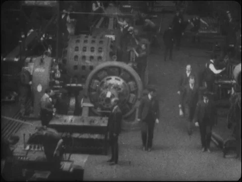 Men busy performing various tasks on machinery in Westinghouse Works - 1904 Stock Footage 91014148
