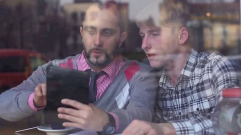Men in cafe discussing the idea Stock-Footage 85223752