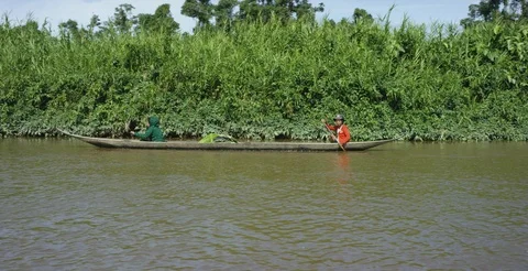 Men canoeing in the river Stock Footage 85756047