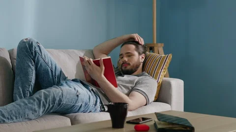 Men Is Captivated by Reading Book Stock Footage 129887140