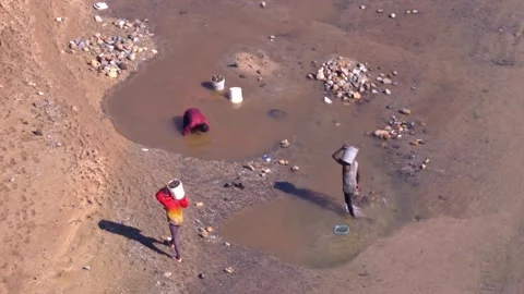 Men Carrying Buckets Of Sand While Illegally Extracting Sediment From The Vídeo Stock 328571368