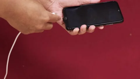 Men charging his phone  Stock Footage 157340314
