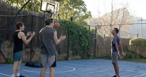 Men cheering, walking off after shooter stepping up, sinking ball through hoop 스톡 동영상 342084933