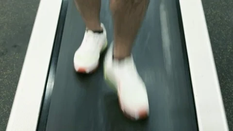 Men clad in sneakers steps on the treadmill. Stock Footage 80395022