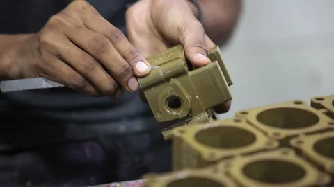 Men clean of casting and applying grease of part, industrial safety first Stock Footage 297739150