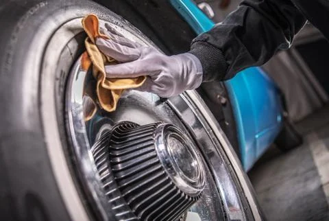 Men Cleaning Car Wheels Using Specialized Chrome Elements Detergent. Stock Photos
