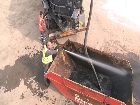 Men cleaning skip Stock Footage 71148459