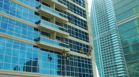 Men Cleaning Windows from Outside in JLT 스톡 동영상 58590547