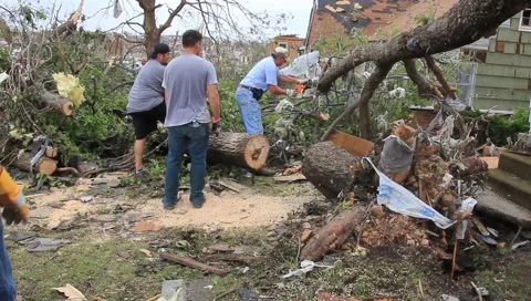 Men CleanUp After Tornado with Chainsaw (HD) c Stock Footage 5504925