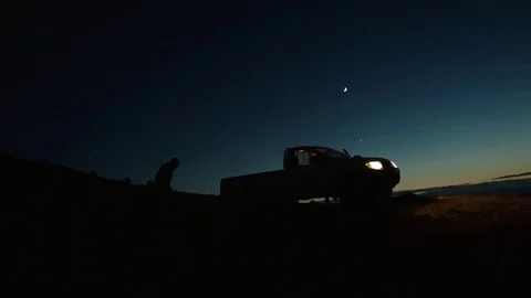Men Climbing on the back of a truck Stock Footage 75207150