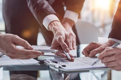 Men close-up, looking in a folder with documents Stock-Fotos