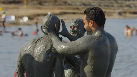 Men covered in mud Stock Footage 86764786