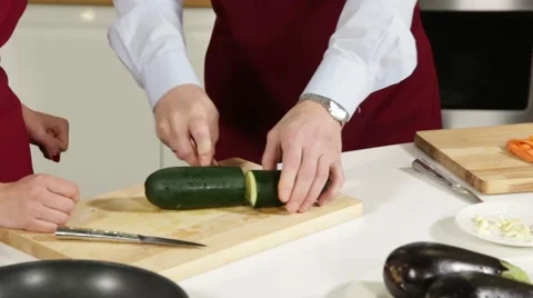 Men cut zucchini Stock Footage 49783443